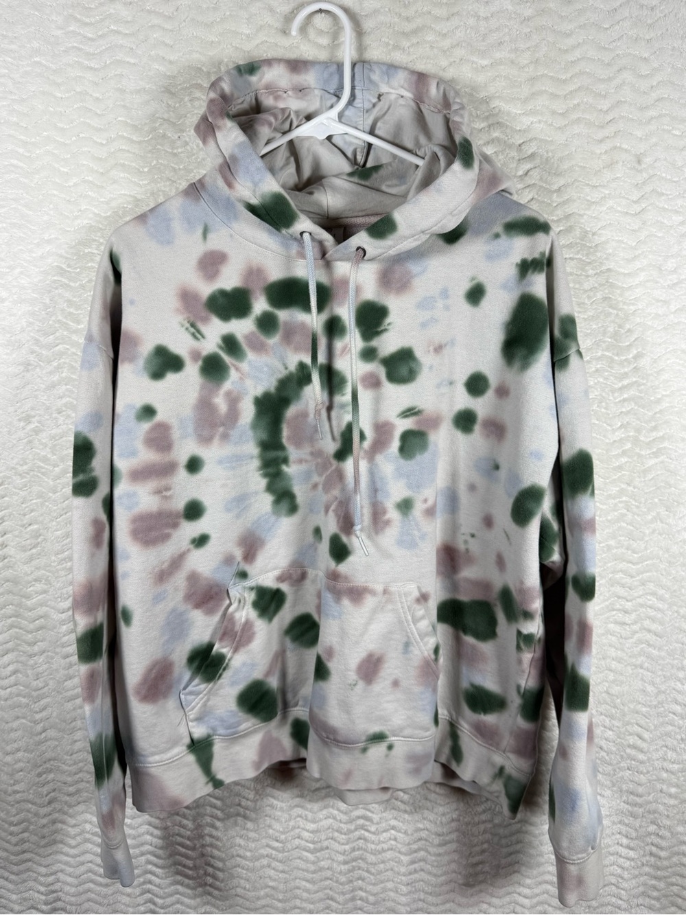 Zine hoodie with multi-color tie-dye pattern with green, gray, and blue tone